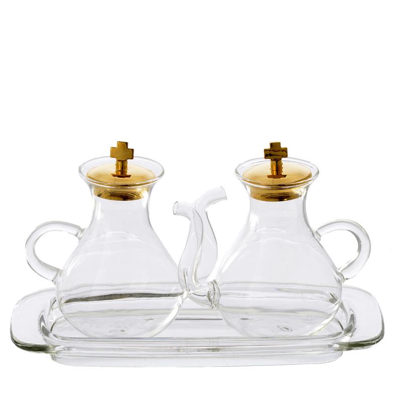 Servizio ampolle in vetro con tappo dorato su vassoio ovale