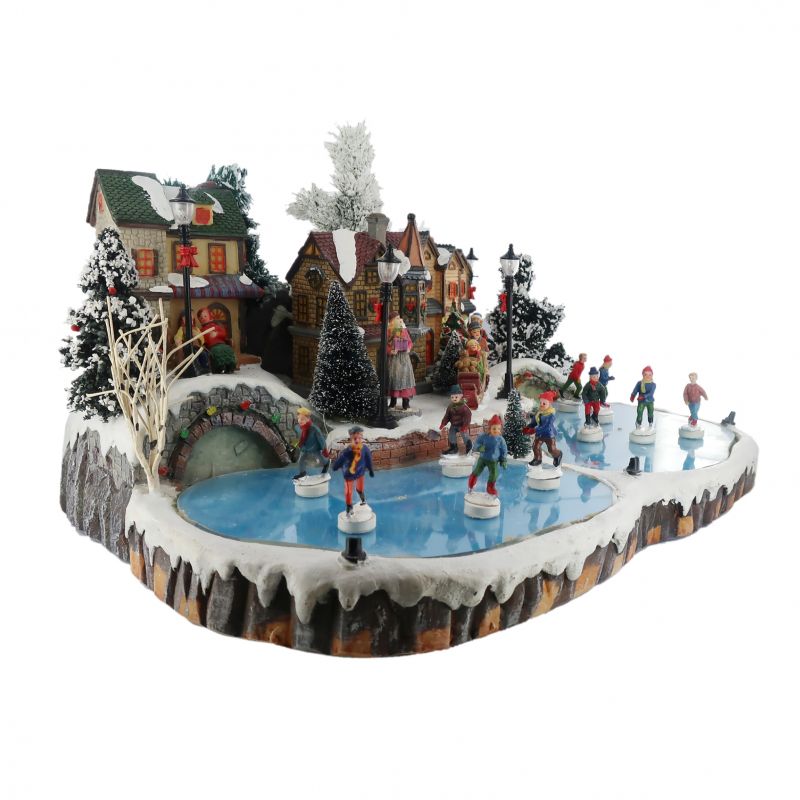 villaggio natalizio con pista di pattinaggio e pattinatori in movimento, con luci e musica (43 x 22 x 38 cm)